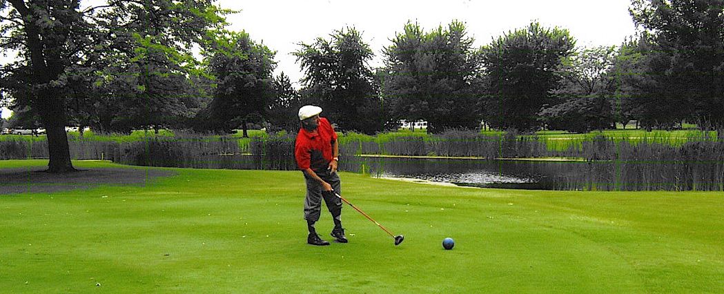  Mark Baranek uses some body english to bring his ball back to the fairway on #17.